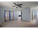 Bright bedroom with tiled floor, ceiling fan and french doors at 2003 Cordero Ct, The Villages, FL 32159