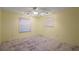 Bedroom with neutral walls, ceiling fan with track lighting and modern vinyl flooring at 2003 Cordero Ct, The Villages, FL 32159