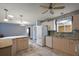 Bright, well-equipped kitchen with stainless appliances, ample counter space, and access to living area at 2003 Cordero Ct, The Villages, FL 32159