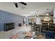 Spacious living area showcasing the open floor plan, bar seating, and seamless flow to kitchen at 2003 Cordero Ct, The Villages, FL 32159