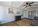 Sunroom featuring wood floors, light blue shiplap walls, and views of the house through the window and doorway at 2003 Cordero Ct, The Villages, FL 32159