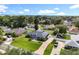 Sprawling property with a pool and long driveway in a neighborhood with mature trees at 2024 Meadowside Dr, Eustis, FL 32726