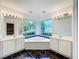 Bright bathroom with a large soaking tub and dual vanities at 2024 Meadowside Dr, Eustis, FL 32726