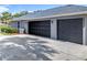 Three-car garage provides ample parking space and storage for vehicles and equipment at 2024 Meadowside Dr, Eustis, FL 32726