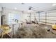 Spacious garage with storage and work area offers a versatile space for projects at 2024 Meadowside Dr, Eustis, FL 32726