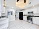 Spacious kitchen with white cabinets and stainless steel appliances at 2024 Meadowside Dr, Eustis, FL 32726