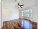 Main bedroom with ceiling fan and bay window at 2024 Meadowside Dr, Eustis, FL 32726