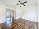 Main bedroom has mirrored closet and view to ensuite bath at 2024 Meadowside Dr, Eustis, FL 32726