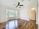 Main bedroom with ceiling fan and bay window at 2024 Meadowside Dr, Eustis, FL 32726