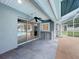 Covered patio features tile flooring, ceiling fans, and access to pool, perfect for entertaining at 2024 Meadowside Dr, Eustis, FL 32726