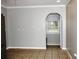Open dining area featuring neutral walls, tile flooring, and an archway leading to another room at 23515 Poinsettia Ave, Fruitland Park, FL 34731