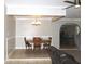 Bright dining space featuring a classic wooden table and chairs, enhanced by a modern chandelier at 23515 Poinsettia Ave, Fruitland Park, FL 34731