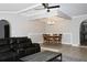 Open-concept living and dining area with a raised dining platform and stylish lighting fixtures at 23515 Poinsettia Ave, Fruitland Park, FL 34731