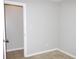 Neutral room with carpet and tile flooring, light switches, and white trim at 23515 Poinsettia Ave, Fruitland Park, FL 34731