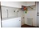 Practical laundry area equipped with a white chest freezer, wall shelving, and storage at 23515 Poinsettia Ave, Fruitland Park, FL 34731