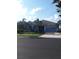 Charming single-Gathering home with a well-manicured lawn, mature trees, and a two-car garage, offering great curb appeal at 245 Blue Cypress Dr, Groveland, FL 34736