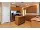 Well-appointed kitchen with an island, stainless steel appliances, and ample cabinetry, making it a chef's dream at 245 Blue Cypress Dr, Groveland, FL 34736