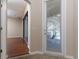 View of the outdoor patio and lake through the sliding glass door at 245 Blue Cypress Dr, Groveland, FL 34736