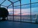 Screened patio overlooking the lake, perfect for evening relaxation at 245 Blue Cypress Dr, Groveland, FL 34736