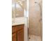 Shower stall with tile surround, glass doors, and modern fixtures in the bathroom at 245 Blue Cypress Dr, Groveland, FL 34736