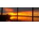 Enjoy breathtaking sunset views over the lake from the patio at 245 Blue Cypress Dr, Groveland, FL 34736