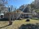 Expansive backyard featuring mature trees, a small shed, and an outdoor picnic table set at 24892 Sw Sailboat Dr, Dunnellon, FL 34431