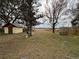 Spacious backyard featuring a shed, well, and partial view of the lake at 24892 Sw Sailboat Dr, Dunnellon, FL 34431