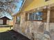 Stone exterior with shuttered windows and outbuilding at 24892 Sw Sailboat Dr, Dunnellon, FL 34431