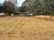 Large open grassed area leading to the house and outbuildings at 24892 Sw Sailboat Dr, Dunnellon, FL 34431