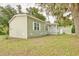 Charming home with fresh curb appeal, featuring vinyl siding and manicured landscaping at 25156 Buttonwood Dr # 126, Astatula, FL 34705
