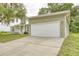 Home with a two-car garage and ample parking space, nestled on a well-maintained lot at 25156 Buttonwood Dr # 126, Astatula, FL 34705