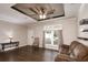Comfortable living room featuring wood floors, a large window, and a plush sofa at 25156 Buttonwood Dr # 126, Astatula, FL 34705