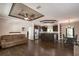 Open-concept living area with stylish flooring, modern ceiling fan, and stainless steel appliances at 25156 Buttonwood Dr # 126, Astatula, FL 34705