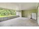 Inviting screened porch featuring a door and space for relaxing or entertaining at 25156 Buttonwood Dr # 126, Astatula, FL 34705
