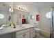 Well-maintained bathroom with a single sink, a tub/shower, and fun decor, perfect for a Gathering home at 25406 Crestwater Dr, Leesburg, FL 34748