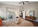 Spacious bedroom with sliding doors to a patio and views of the backyard, great for relaxation and enjoying the outdoors at 25406 Crestwater Dr, Leesburg, FL 34748