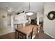 Open dining area with wood floors, adjacent to kitchen and living spaces; bright and inviting at 25406 Crestwater Dr, Leesburg, FL 34748