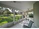 Enjoy Florida evenings bug-free on this spacious screened patio overlooking the landscaped backyard at 25406 Crestwater Dr, Leesburg, FL 34748