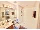 Functional bathroom with a walk-in shower, vanity, and neutral finishes, offering convenience and style at 26612 Bella Vista Dr, Howey In The Hills, FL 34737