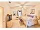 Cozy bedroom with a four-poster bed, ample lighting, and tasteful decor, creating a relaxing atmosphere at 26612 Bella Vista Dr, Howey In The Hills, FL 34737