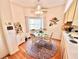 Cozy dining area with a glass table, chandelier, and views of the garden at 26612 Bella Vista Dr, Howey In The Hills, FL 34737