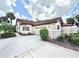 Charming single-Gathering home with a tile roof, well-maintained landscaping, and a spacious driveway at 26612 Bella Vista Dr, Howey In The Hills, FL 34737
