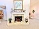 Traditional fireplace with decorative mantle and hearth, adorned with decorative accents at 26612 Bella Vista Dr, Howey In The Hills, FL 34737
