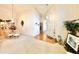 Welcoming foyer with chandelier, hardwood floors, and dining area at 26612 Bella Vista Dr, Howey In The Hills, FL 34737