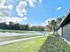 Beautiful golf course view with lush green grass and serene pond, perfect for relaxation at 26612 Bella Vista Dr, Howey In The Hills, FL 34737