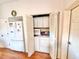 Convenient laundry closet with washer and dryer connections, adjacent to the kitchen area at 26612 Bella Vista Dr, Howey In The Hills, FL 34737