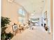 Bright living room with vaulted ceilings, fireplace, and comfortable seating perfect for relaxation at 26612 Bella Vista Dr, Howey In The Hills, FL 34737