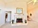 Inviting living room featuring a fireplace and dining area, enhanced by high ceilings and natural light at 26612 Bella Vista Dr, Howey In The Hills, FL 34737