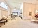Spacious living room with high ceilings, fireplace, and dining area at 26612 Bella Vista Dr, Howey In The Hills, FL 34737