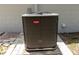 New Bryant AC unit sitting on a concrete pad next to a well maintained home at 2701 S Dellwood Dr, Eustis, FL 32726